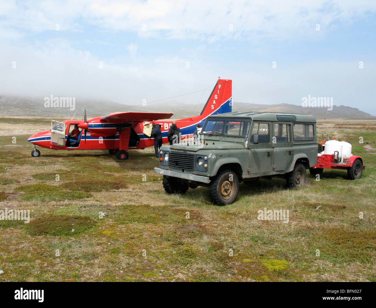 Falkland Islands, Carcass Island. Falkland Islands Government Air Service (FIGAS) Islander on grass airstrip. Stock Photo
