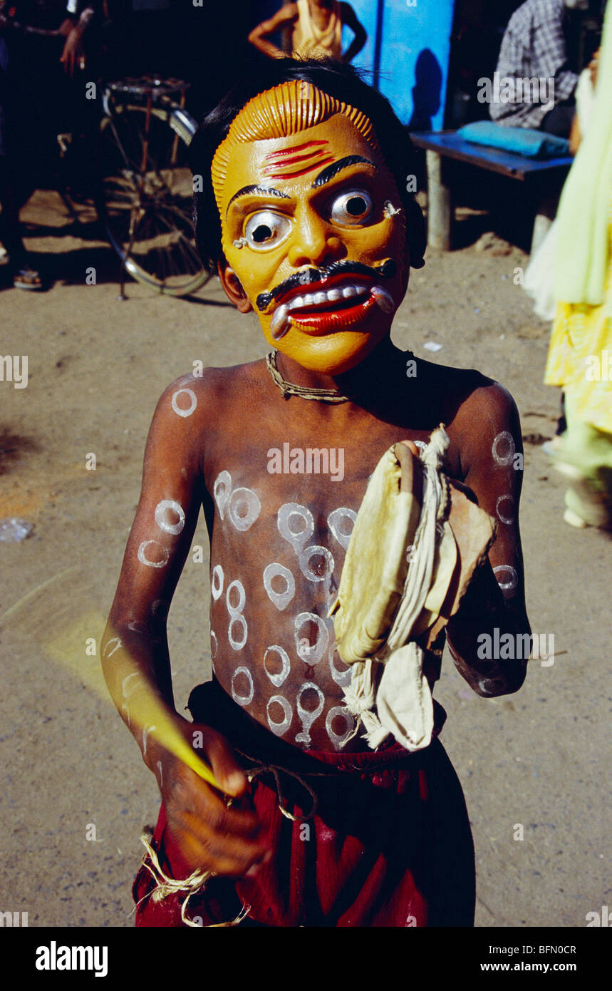 Rathwa tribal masked boy celebrating Holi festival ; Kawant ; Gujarat ; India Stock Photo
