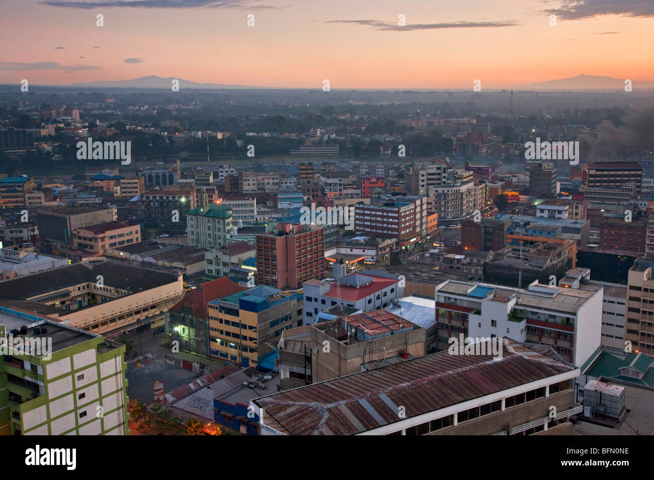 Kenya, Nairobi. Nairobi at daybreak with Mount Kenya (right) and the