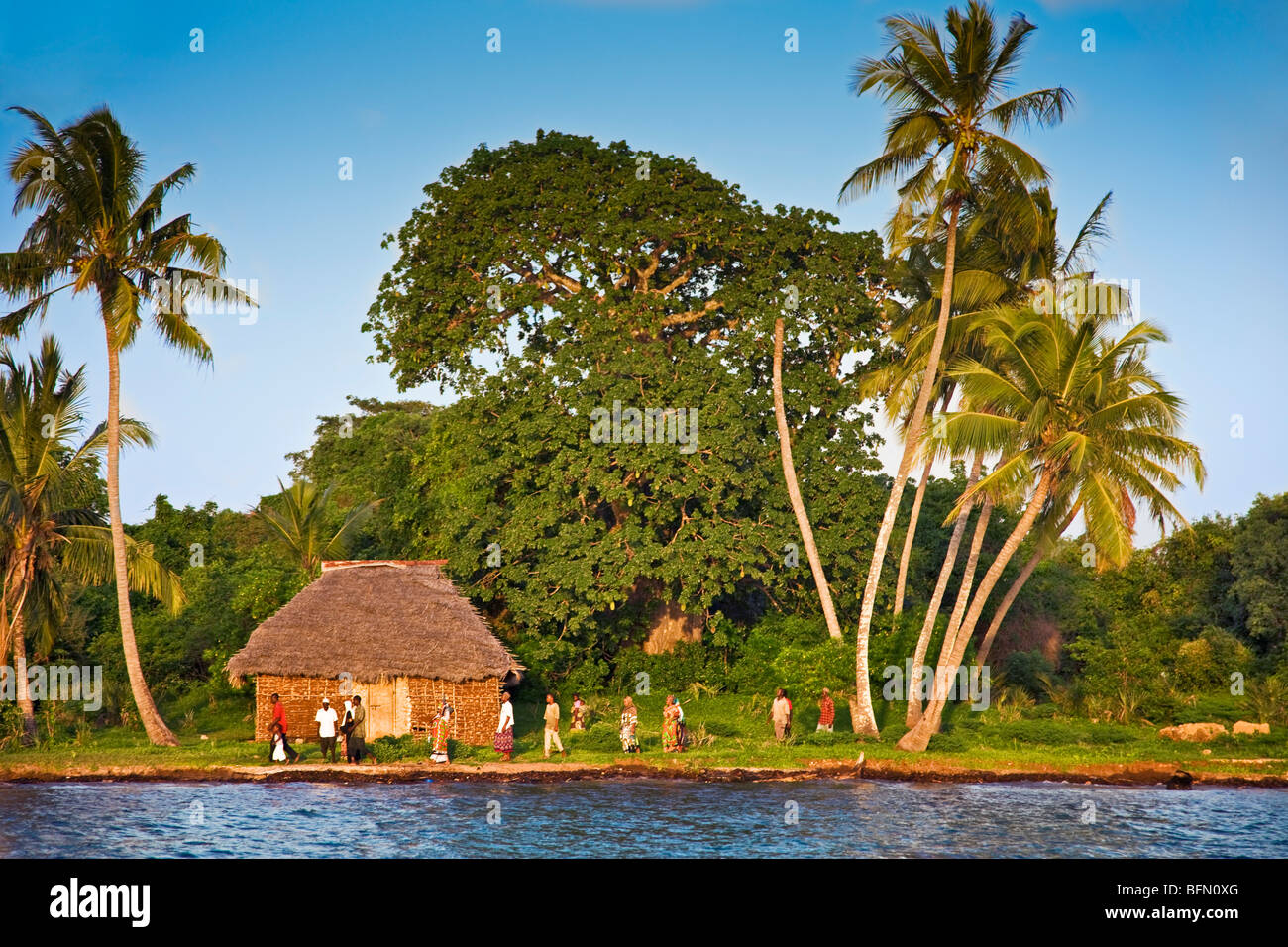 Kenya, Mombasa. In the late afternoon, Residents of Funzi Island, off Kenyas south coast, make their way towards a ferry Stock Photo