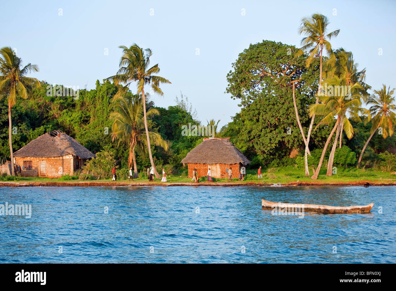 Kenya, Funzi Island. In the late afternoon, Island residents, make their way towards a ferry to take them to the mainland. Stock Photo