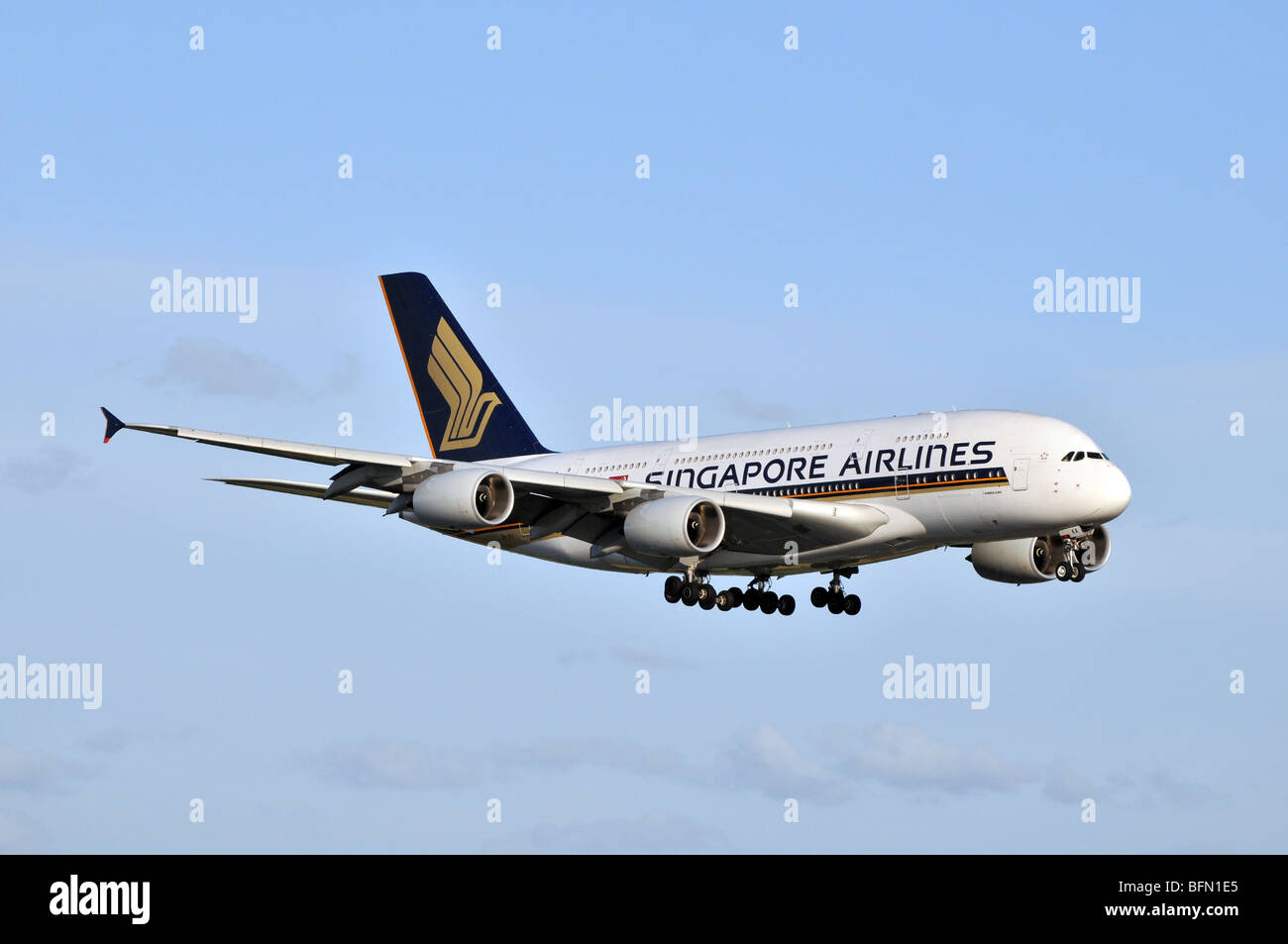 An Airbus A380 of Singapore Airlines on final approach to landing - with the undercarriage being lowered Stock Photo