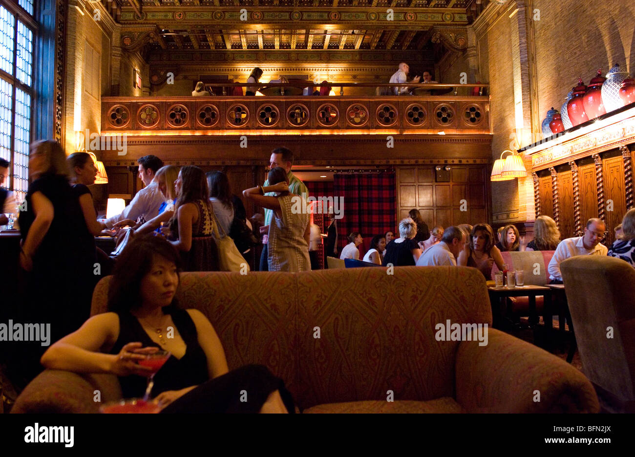 Woman drinking cocktails at the Campbell Apartment bar, Grand Central