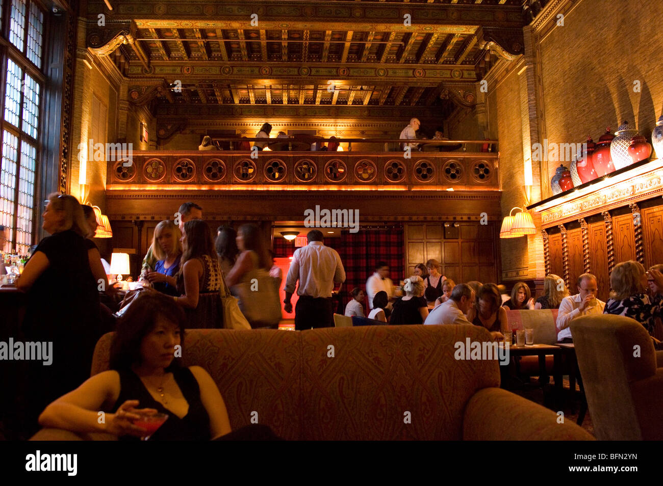 Woman drinking cocktails at the Campbell Apartment bar, Grand Central