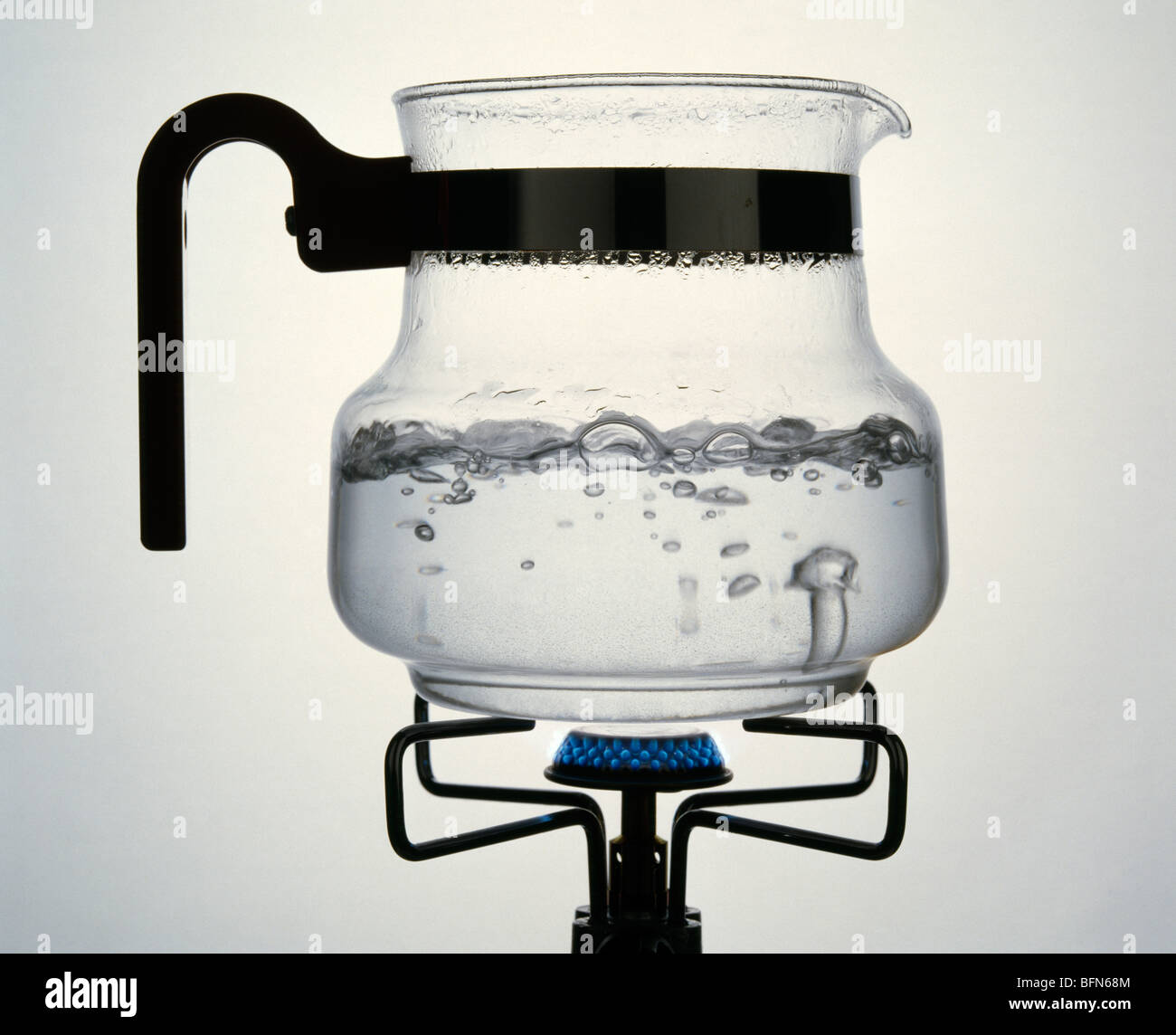 WATER Evaporation Steam rising from water boiling in a clear