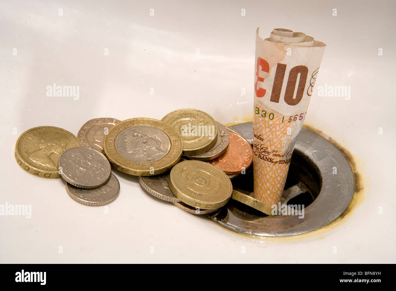 English Money Going Down The Drain Stock Photo 26898245 Alamy - 