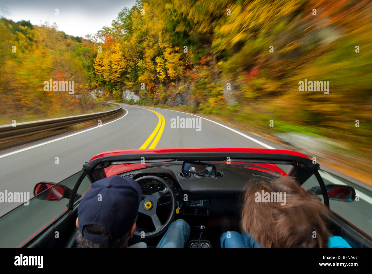 driving an italian sportscar at speed on a country road Stock Photo Alamy