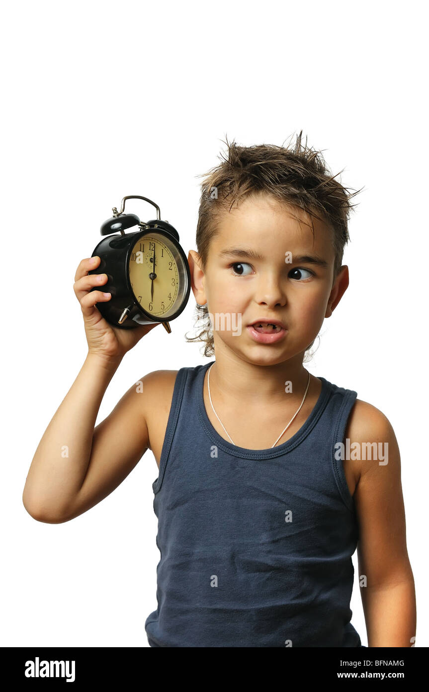 Kid with alarm clock in the hand on a white background Stock Photo