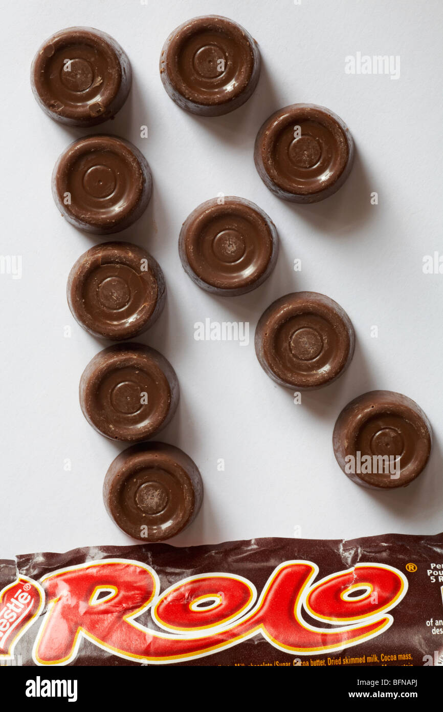 R - Rolos, Nestle Rolo chocolates removed from packet arranged in letter R set on white background Stock Photo