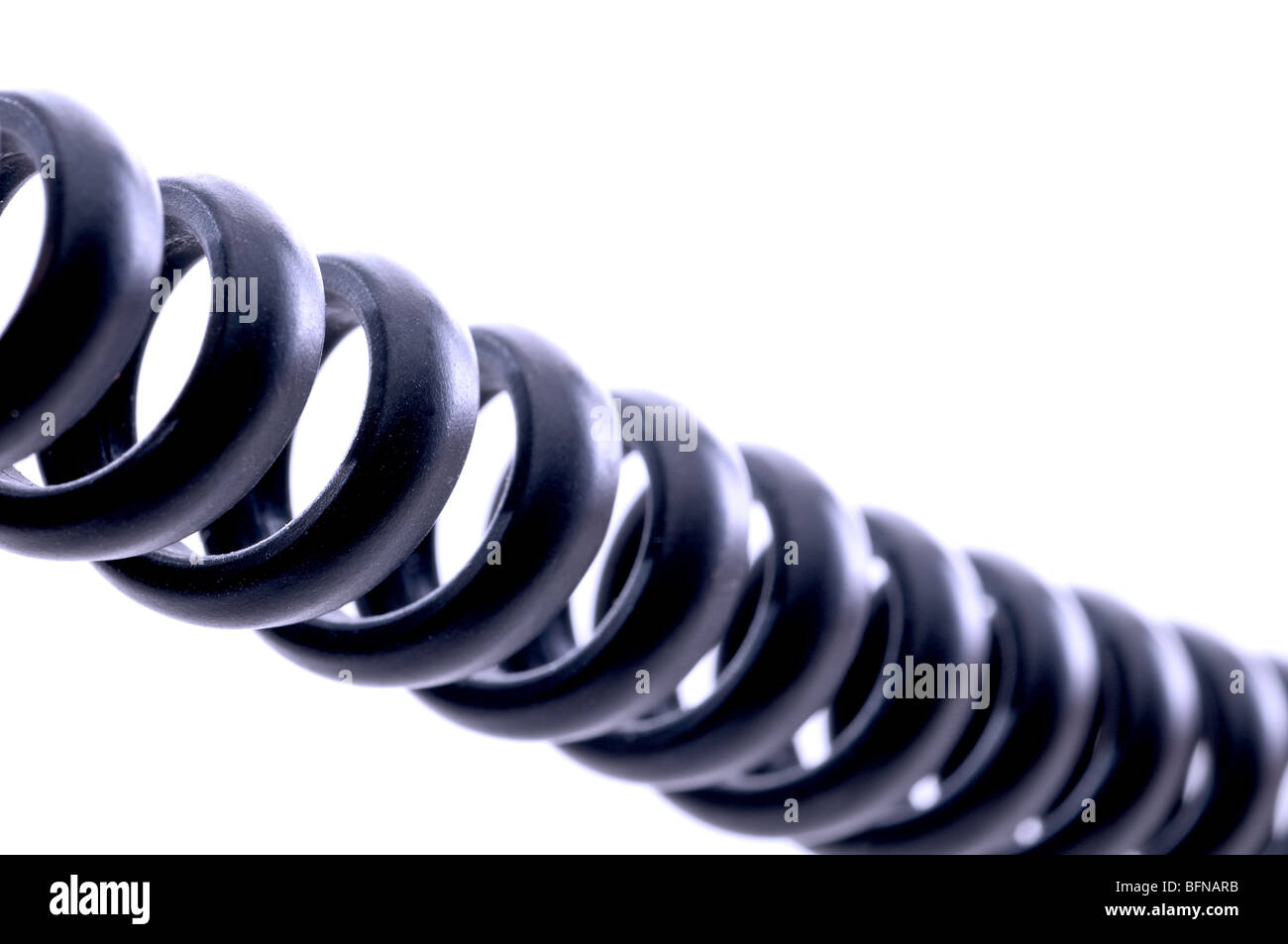 Shallow focus macro of a coiled telephone cord Stock Photo