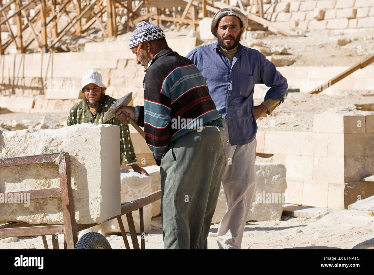 Men involved in restoration work at the Step Pyramid of Pharaoh Djoser at Sakkara, near Cairo Egypt Stock Photo