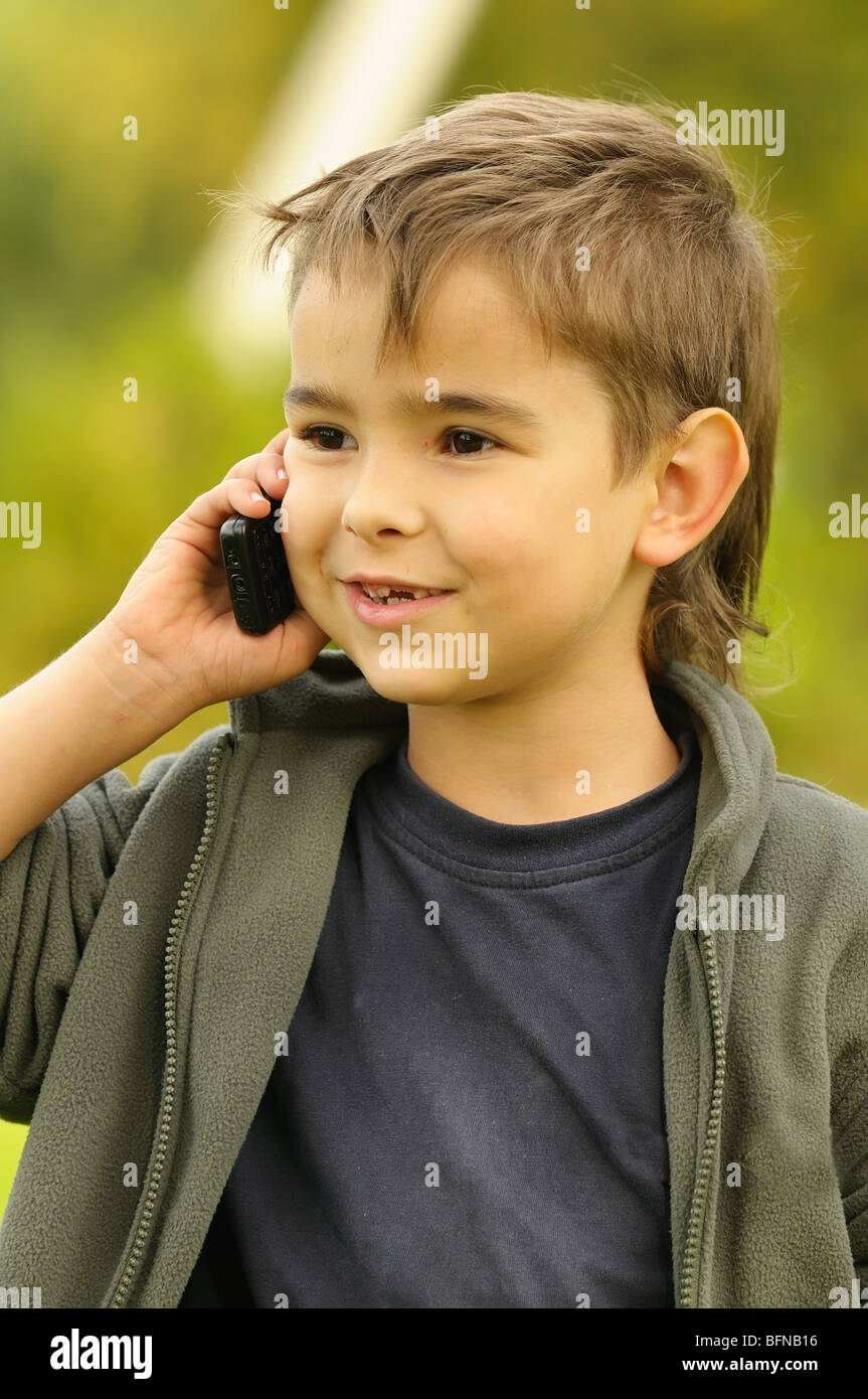boy talking on a mobile phone Stock Photo