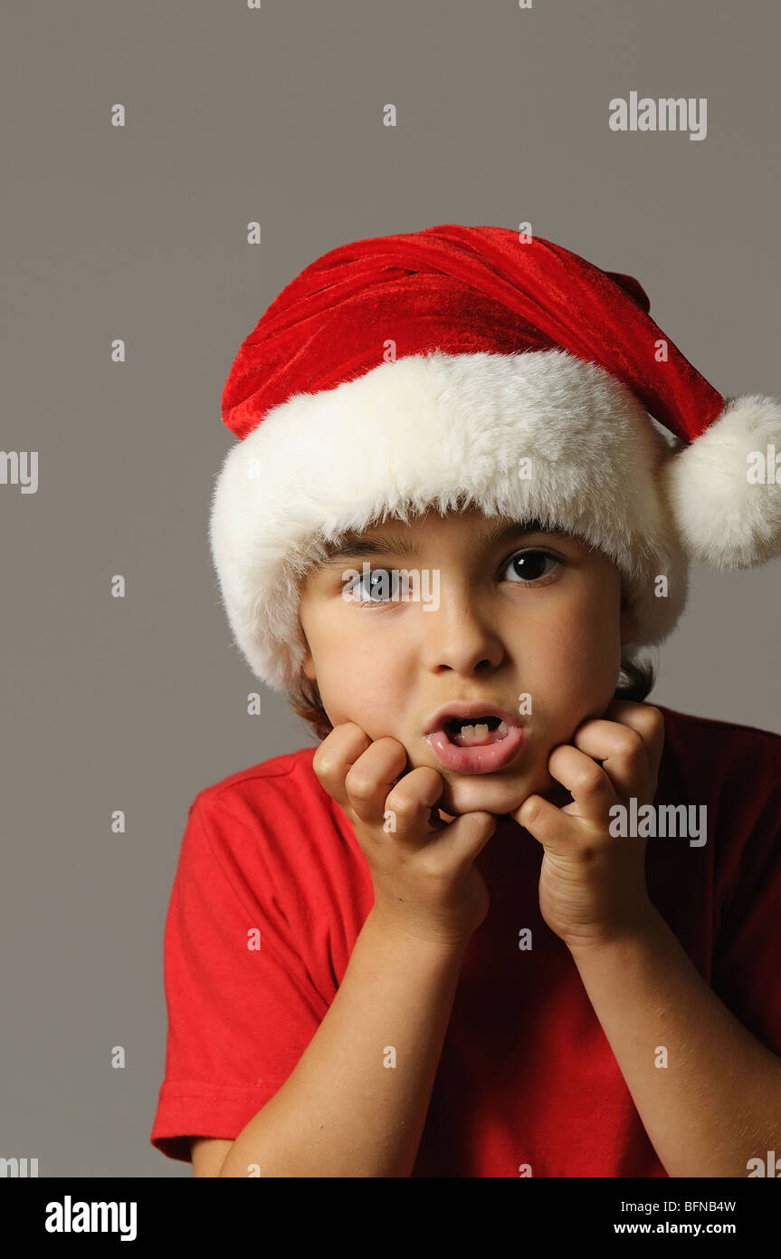 Kid in Santa hat and red tshirt Stock Photo