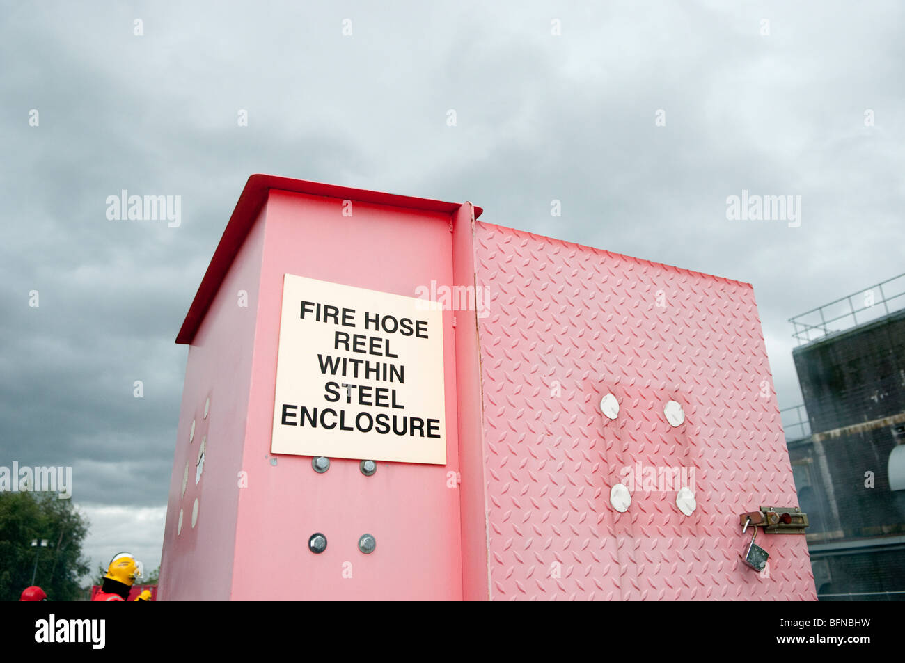 Fire hose reel within steel enclosure Stock Photo