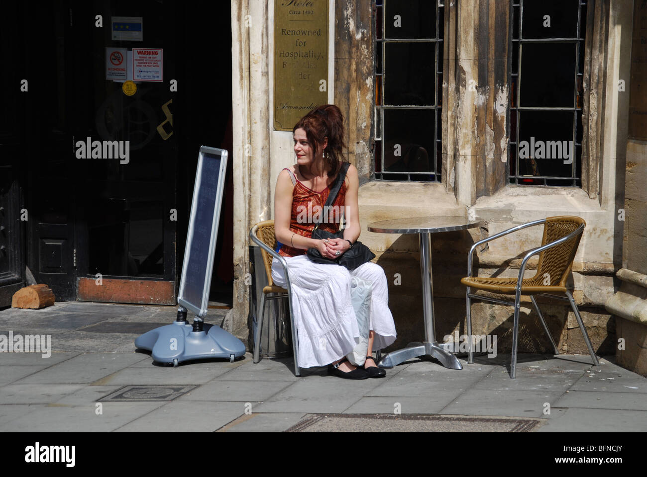 colourful people in Glastonbury High Street Somerset England Stock Photo