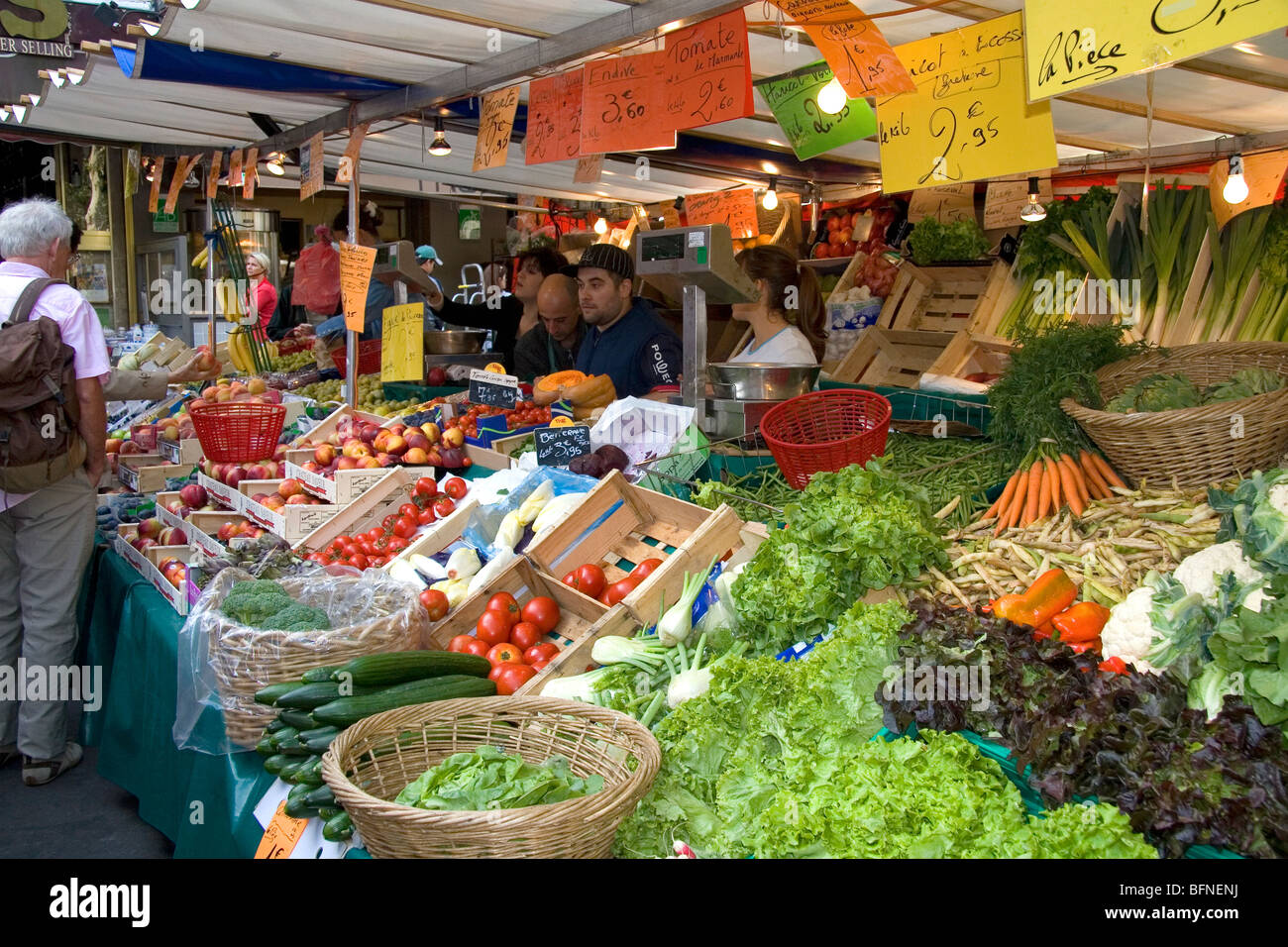 People shopping for produce at an outdoor Saturday market in Paris, France. Stock Photo