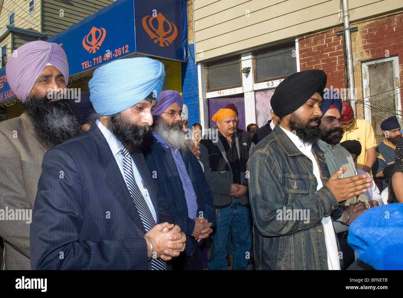 Members the Singh Sabha of New York conduct a prayer with members of other religious congregations in Flushing, Queens New York Stock Photo