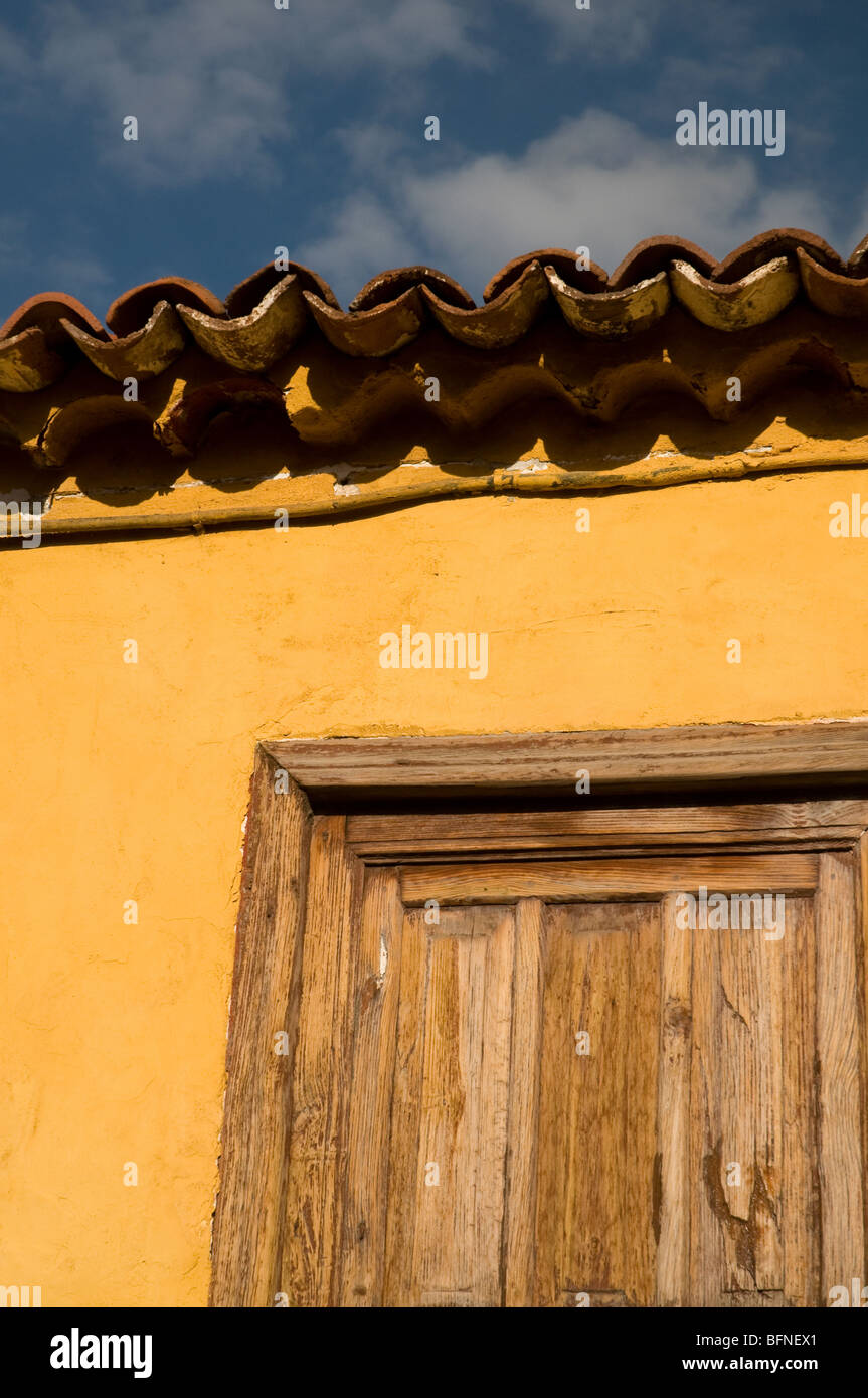 Spanish rustic traditional door  in Tenerife in a building painted yellow Stock Photo