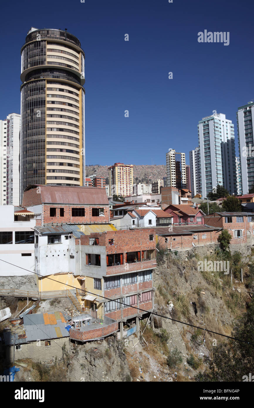 Contrasting modern skyscrapers and precarious slum housing side by side, Sopocachi , La Paz , Bolivia Stock Photo