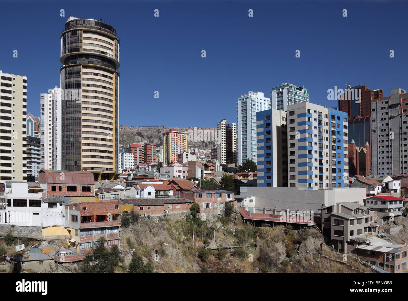 Contrasting modern skyscrapers and precarious slum housing side by side, Sopocachi , La Paz , Bolivia Stock Photo