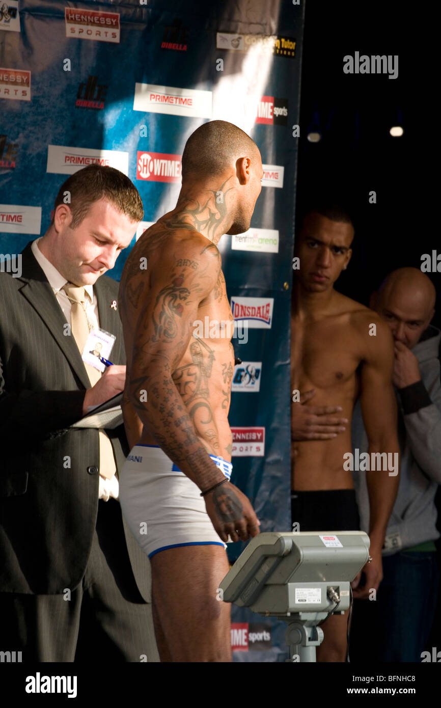 Two fighters eyeing each other up during the weigh in the day before