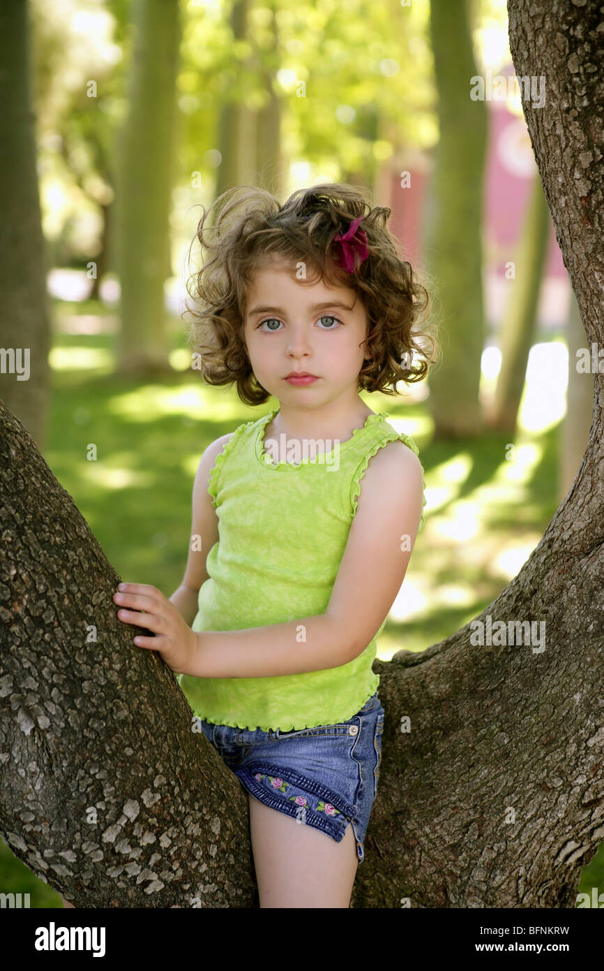 Beautiful Blue Eyes Little Girl And A Tree On The Park Green Grass Stock Photo Alamy