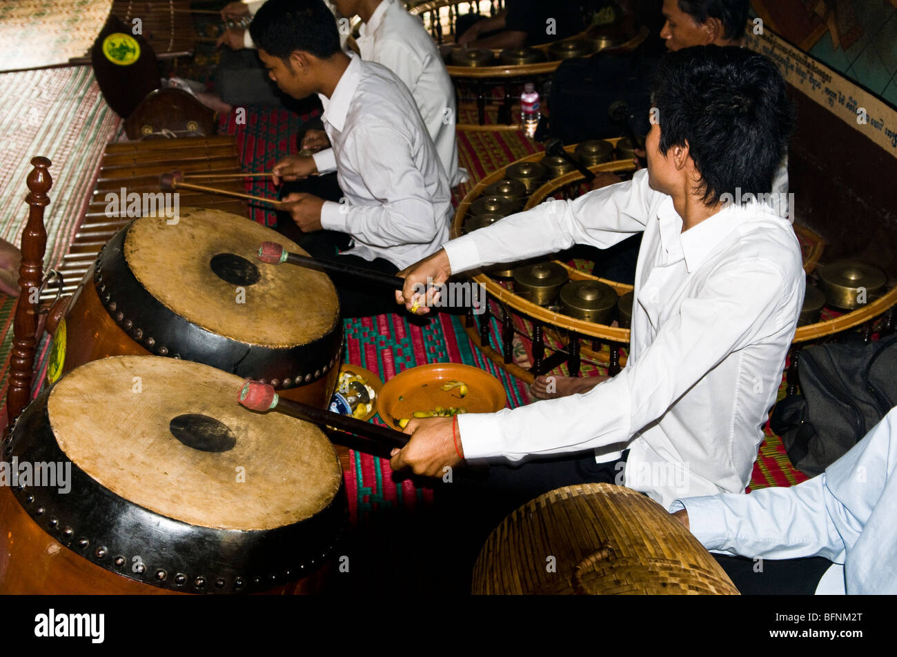 Playing traditional musical instruments in Wat Phnom , Phnom Penh, Cambodia. Stock Photo