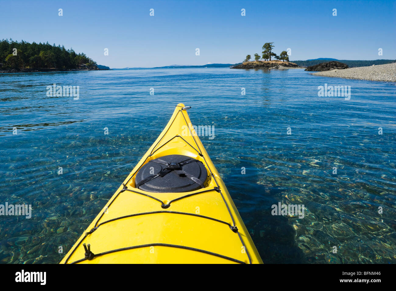 The bow of a sea kayak on the water near Turn Island in the San Juan Islands of Washington State, USA. Stock Photo