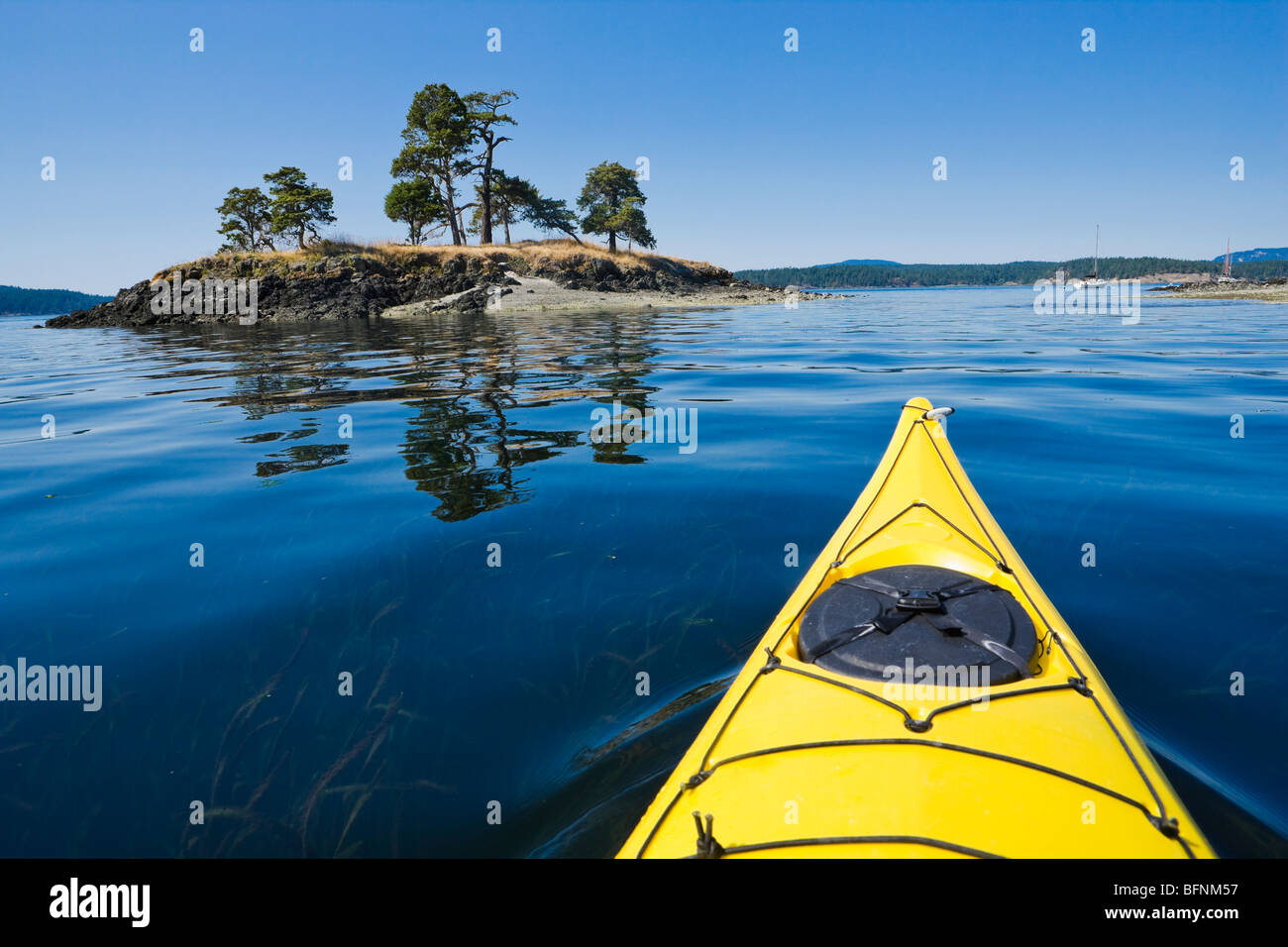 The bow of a sea kayak on the water near Turn Island in the San Juan Islands of Washington State, USA. Stock Photo