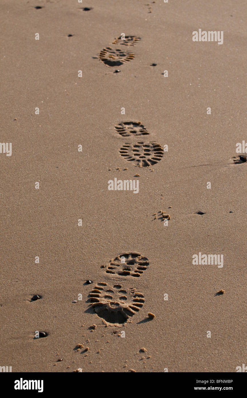 Boot prints in the sand at Mundesley, Norfolk Stock Photo
