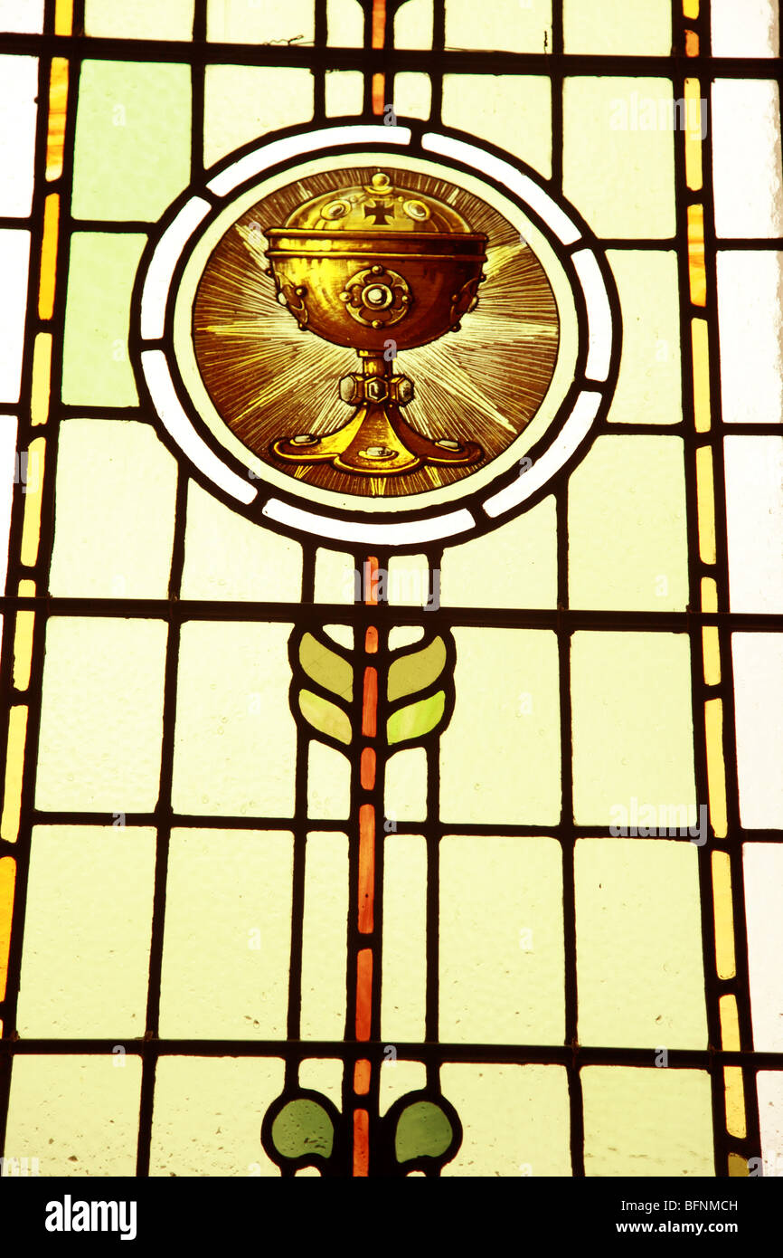 Church Stain Glass Window depicting the chalice of Jesus Christ Stock