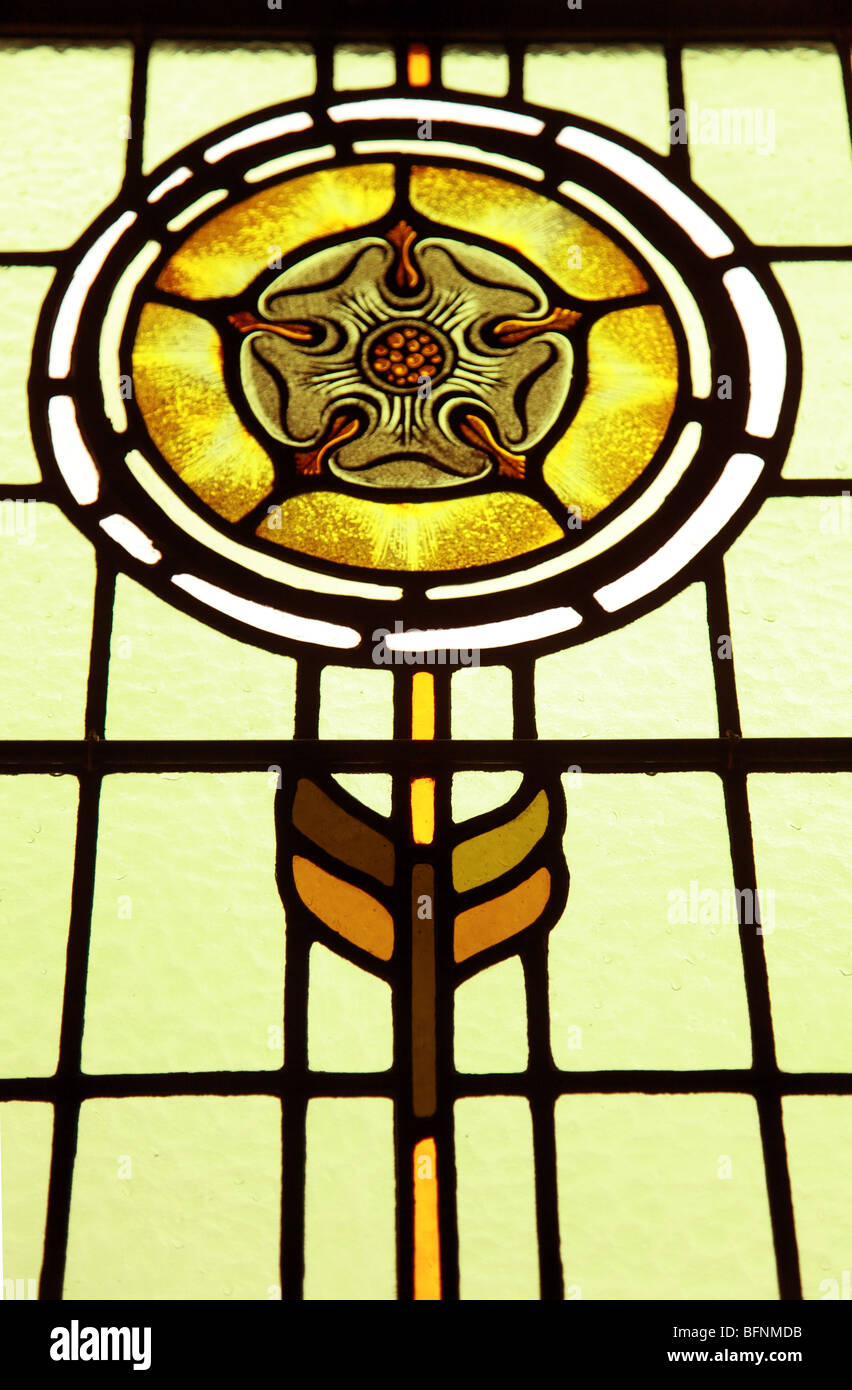 Church Stain Glass Window depicting a rose Stock Photo