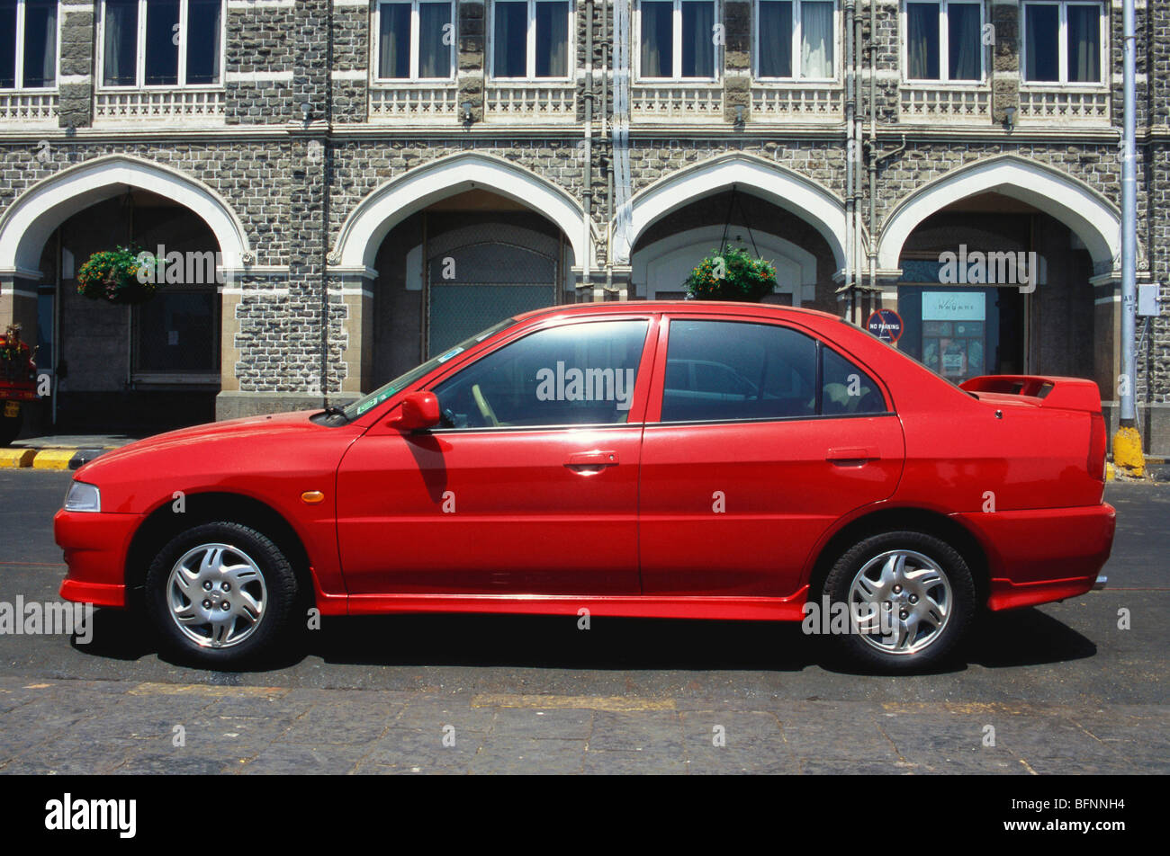 NMK 62558 : Mitsubishi lancer ; red car ; Fort ; Bombay Mumbai ; Maharashtra ; India Stock Photo