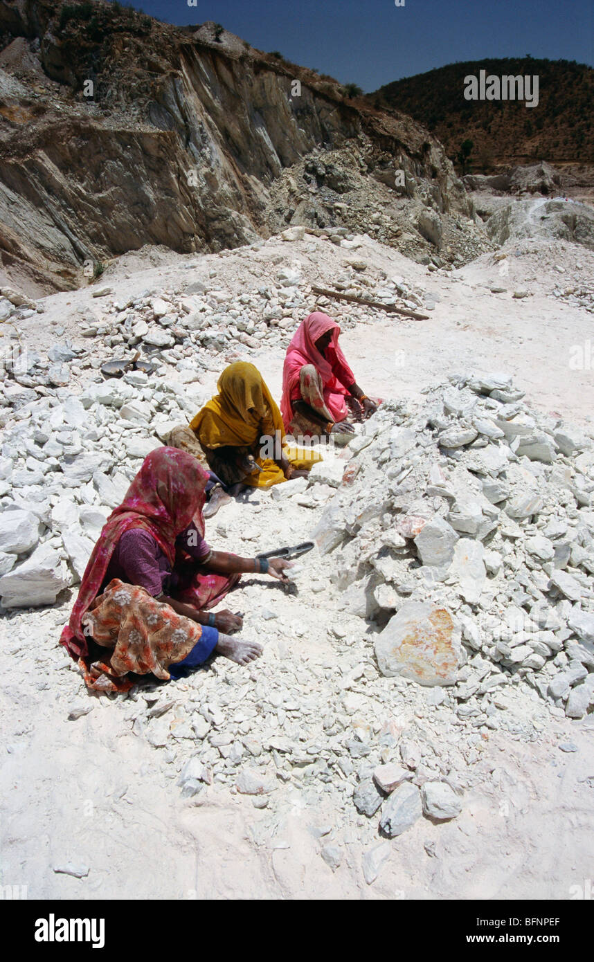 Women working breaking soapstone in mine ; Udaipur ; Rajasthan ; India