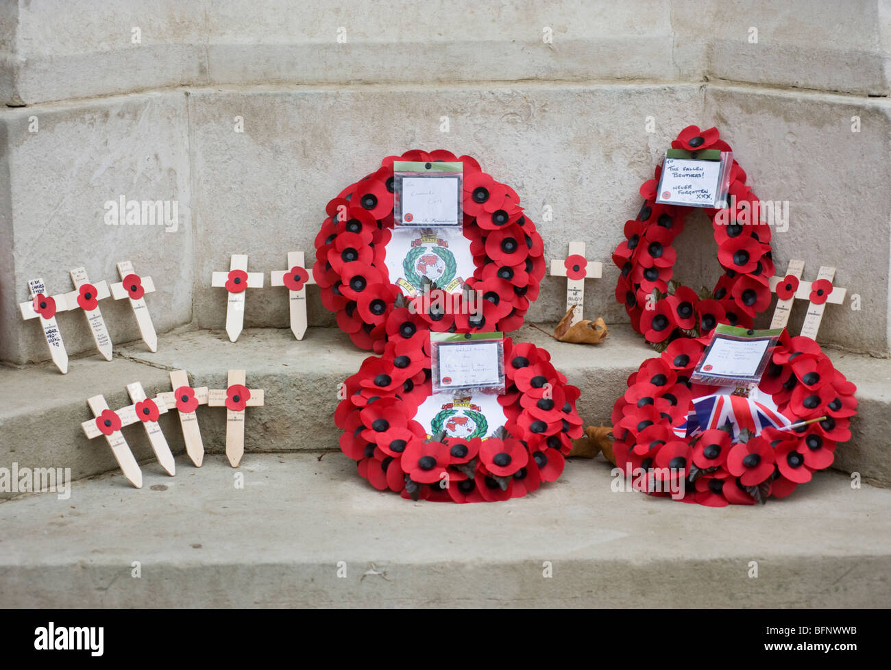 poppy wreaths and wooden crosses on stone steps Stock Photo