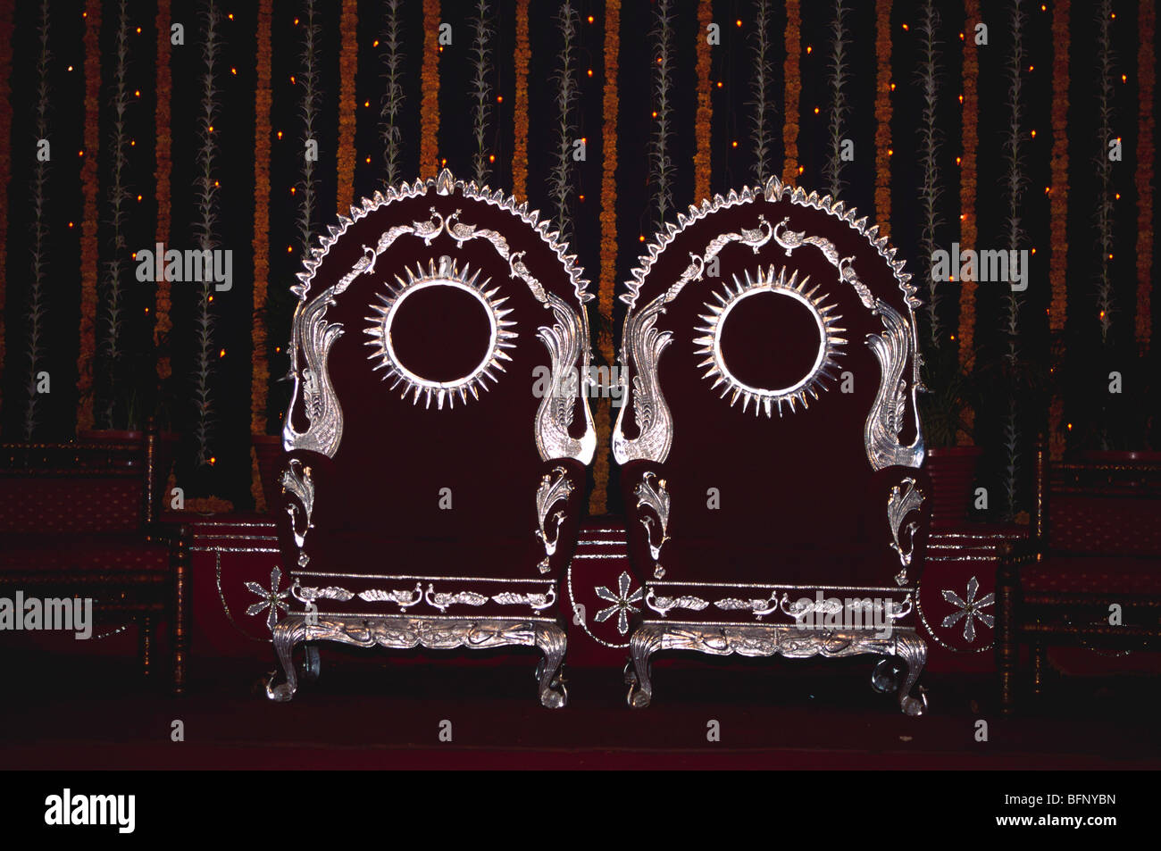 NMK 64147 : Decorated two empty vacant wedding reception chairs of bride & bridegroom ; Bombay Mumbai ; Maharashtra ; India Stock Photo
