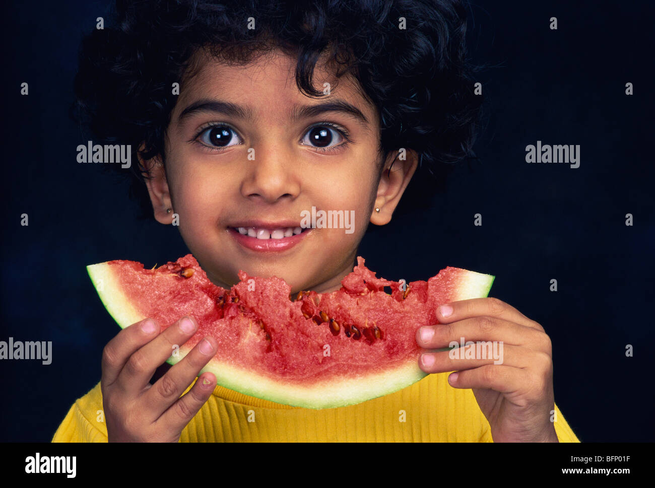 child eating watermelon ; India ; asia ; MR#191 Stock Photo