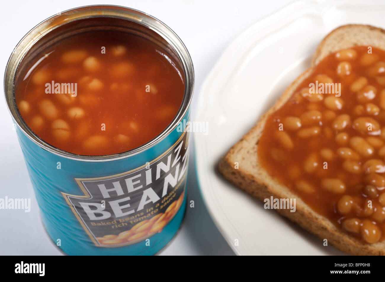 Heinz baked beans on toast, a traditional snack food in Great Britain Stock Photo