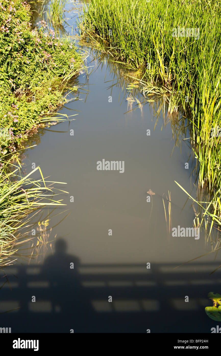 Shadow of Man on a bridge Stock Photo - Alamy