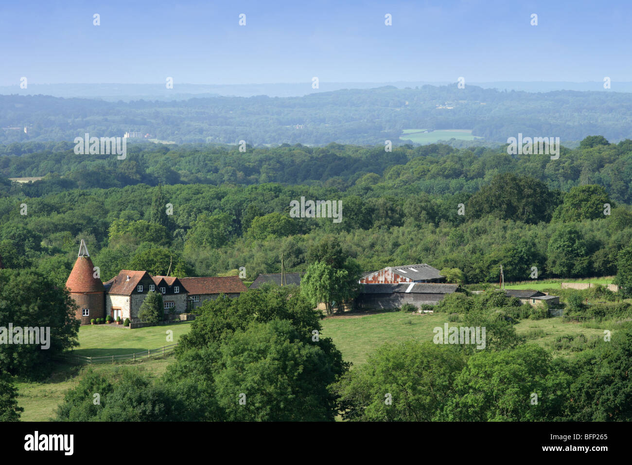Distant view of oast house in Kent weald, taken from road Stock Photo