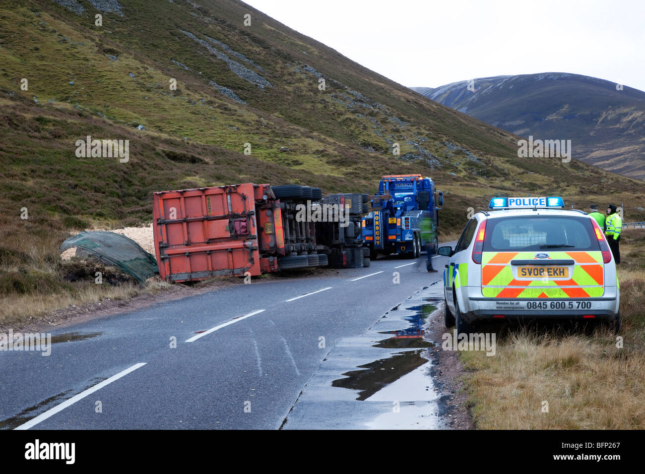 Overturned Heavy Goods Wood Lorry spilling forestry saw mill waste bulk