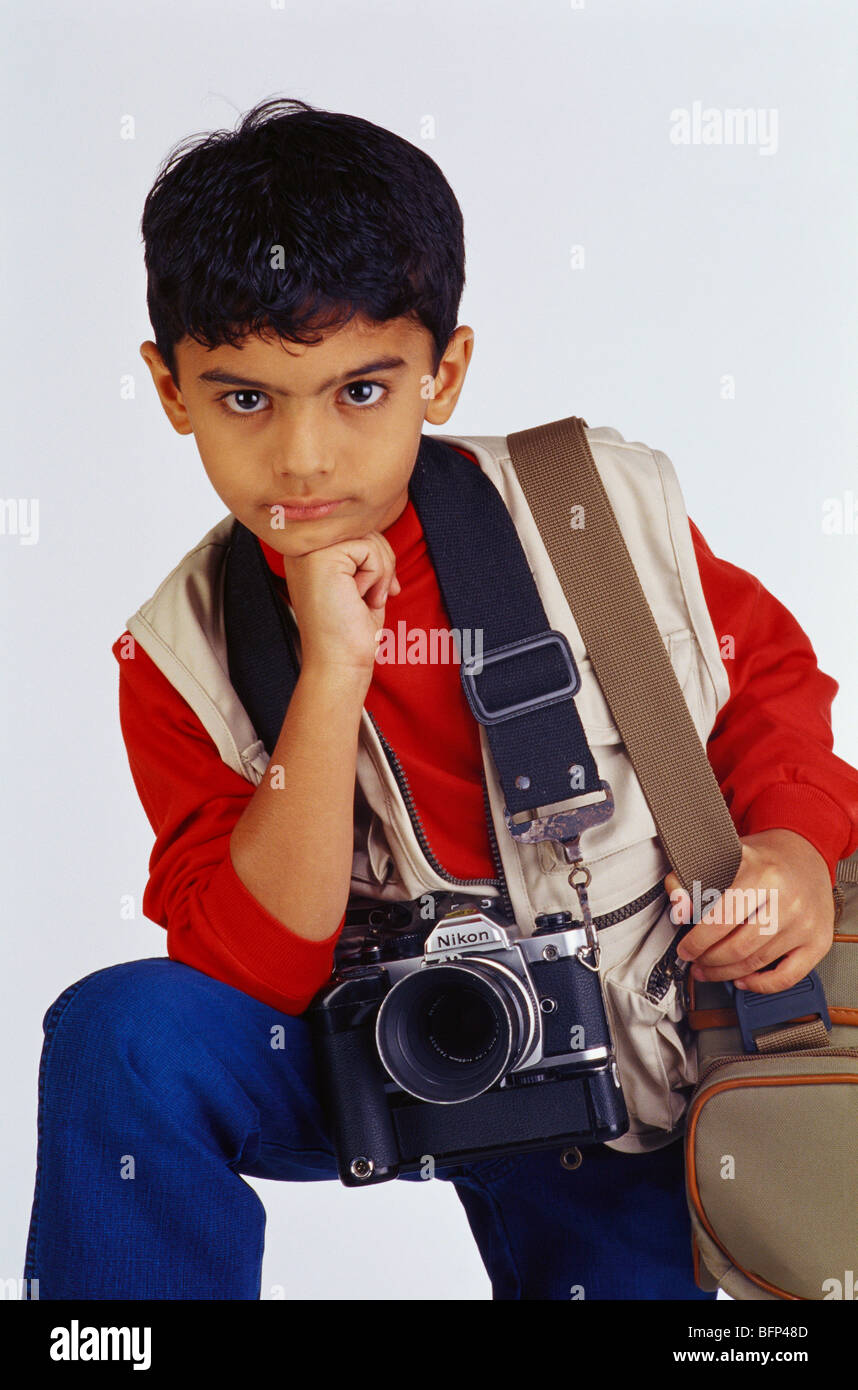 Indian child boy in fancy dress costume of photographer  with camera and bag ; India ; Asia ; MR#494 Stock Photo