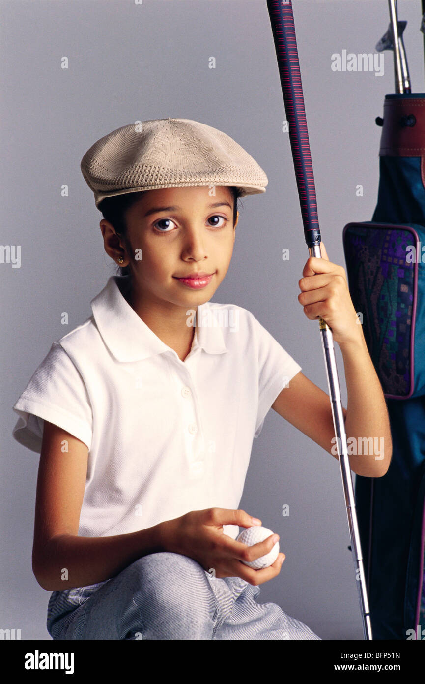 Indian child girl in fancy dress costume of golfer with golf club and ball ; India ; Asia ; MR#493 Stock Photo