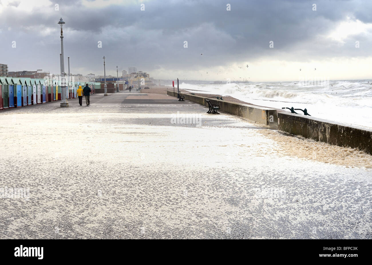 Seaspray is blown over onto Brighton promenade in a storm Stock Photo