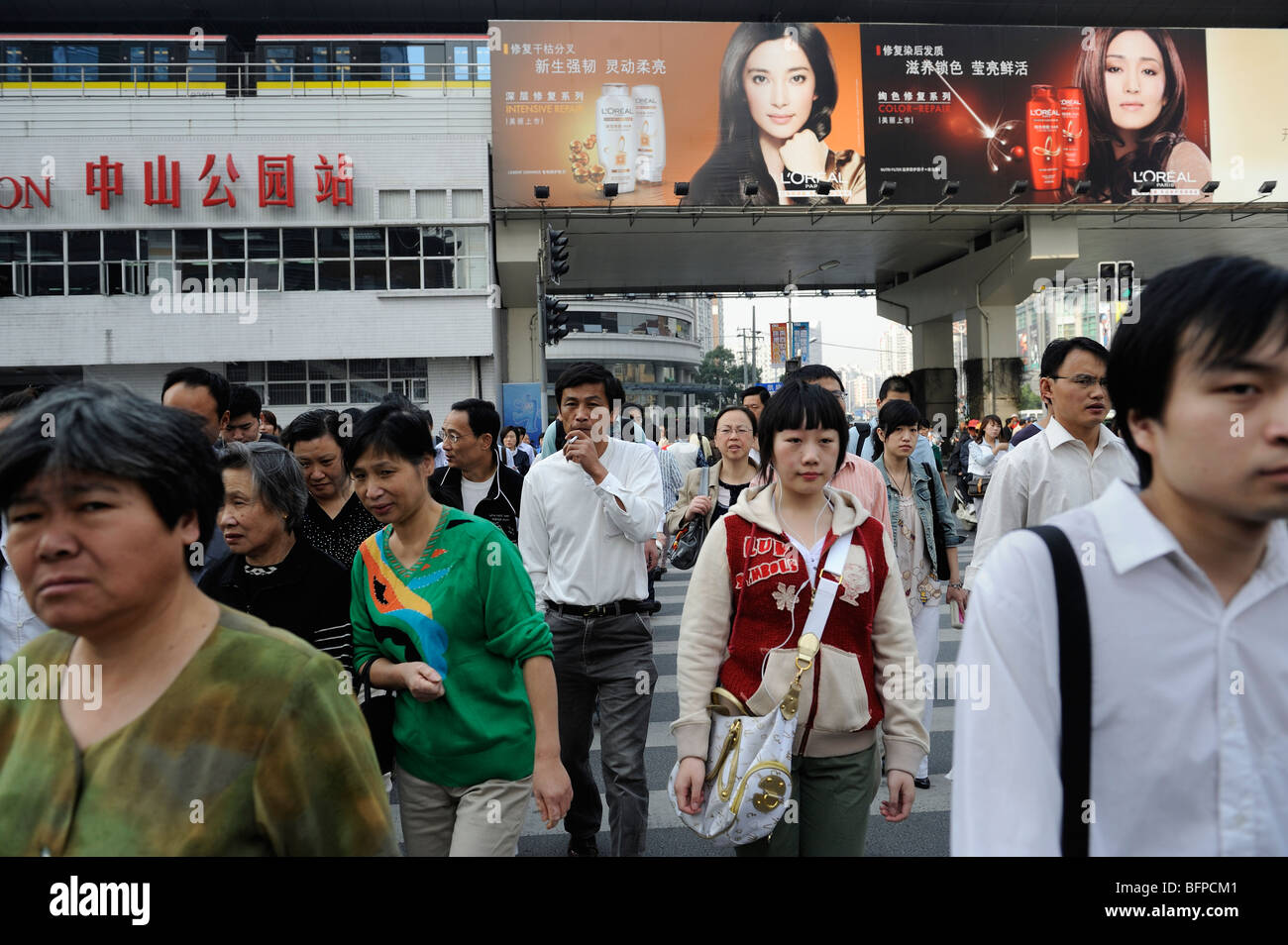 People walking through a street in Shanghai, China. 19-Oct-2009 Stock Photo