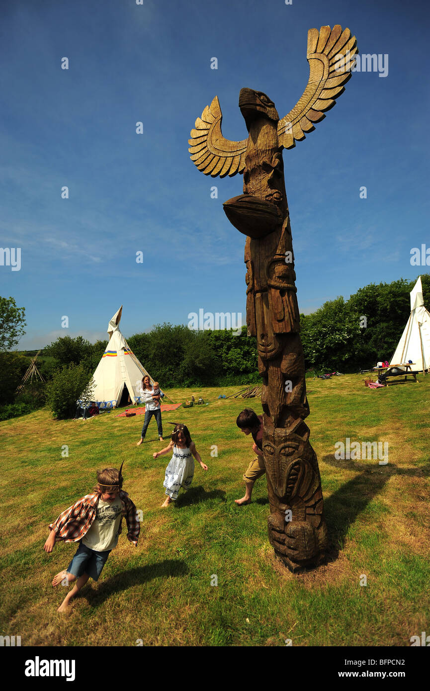 a family on a tipi wigwam camping holiday vacation in Cornwall UK Stock Photo