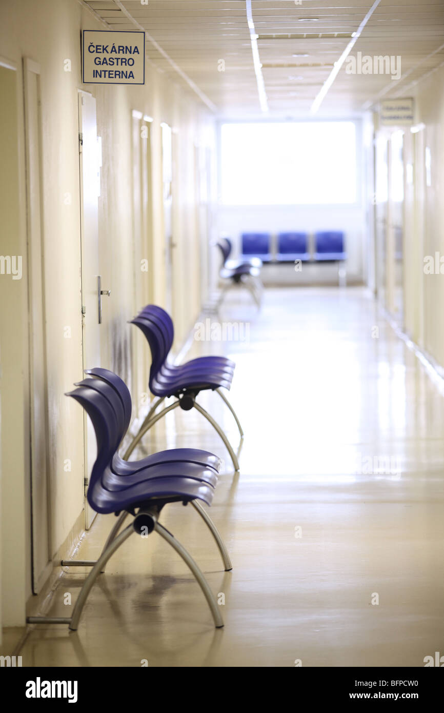 a corridor in a clinic with empty seats Stock Photo