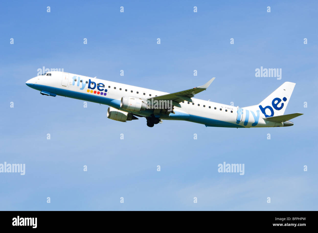 Embraer ERJ-190 operated by Flybe climbing out after take off from Birmingham Airport, UK. Stock Photo