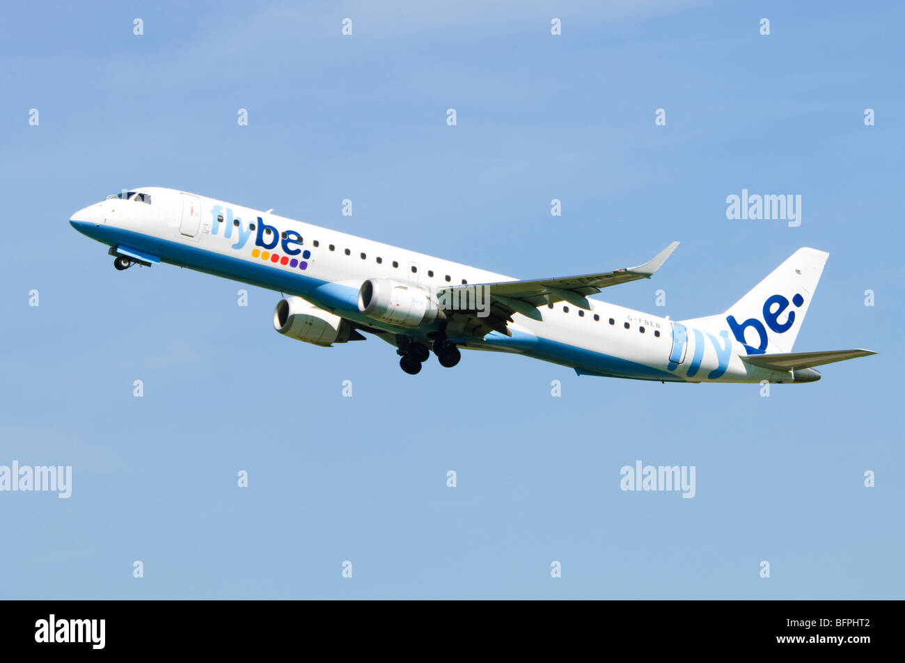 Embraer ERJ-190 operated by Flybe climbing out after take off from Birmingham Airport, UK. Stock Photo