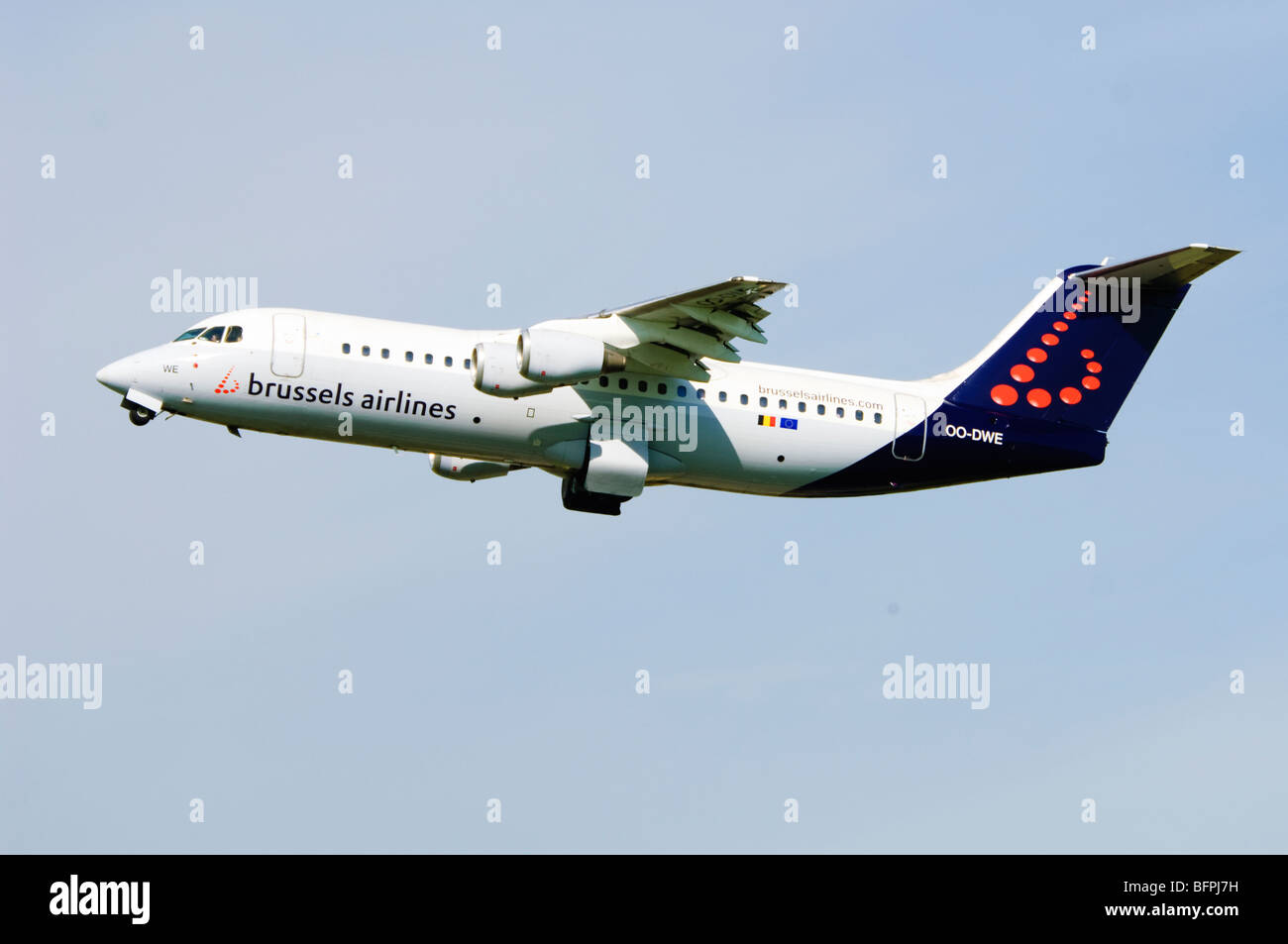 Avro RJ100 operated by Brussels Airlines climbing out from taking off at Birmingham Airport, UK. Stock Photo